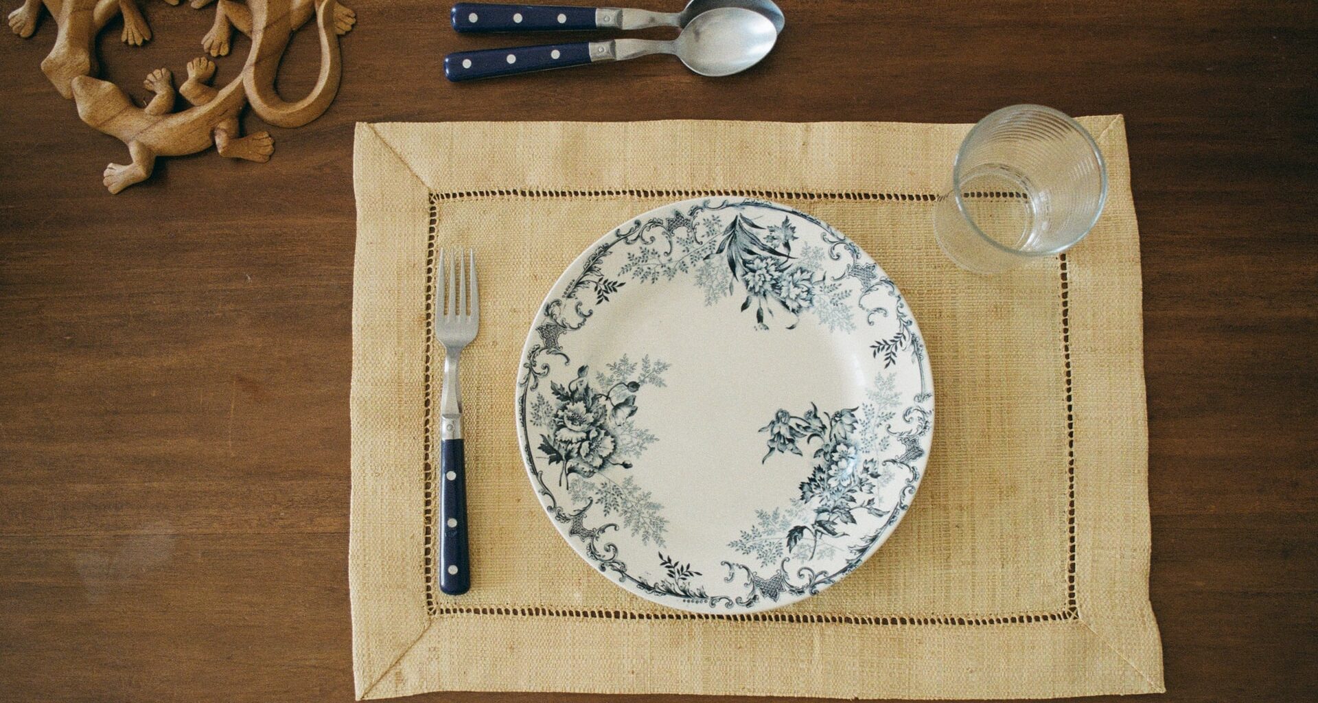 Empty plate and cutlery on a dining table