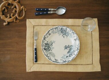 Empty plate and cutlery on a dining table